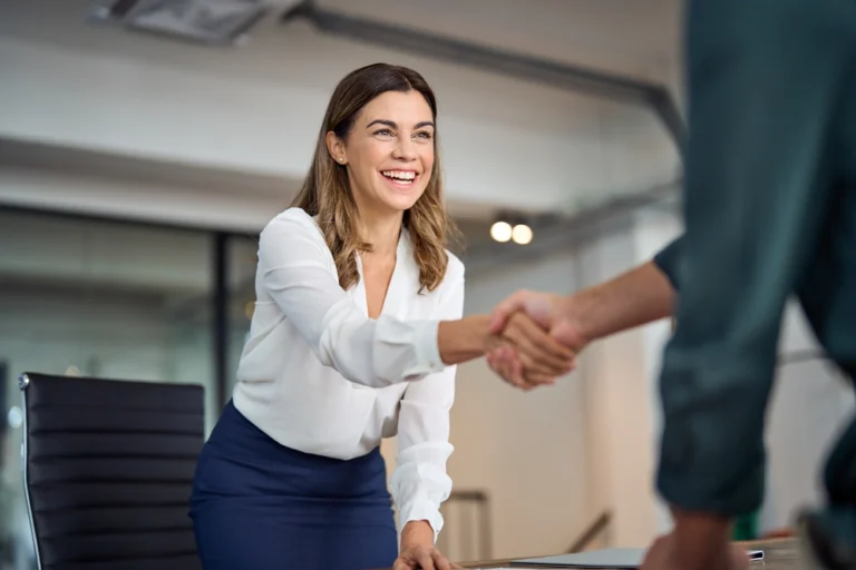 woman-shakes-job-applicant_s-hand-at-sand-law-in-north-dakota.webp